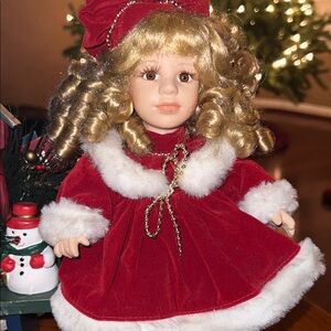Vintage Porcelain Christmas Doll Sitting On Bench- Doll is 11” tall, EUC